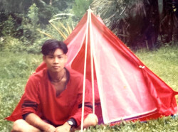 rain camping in a poncho